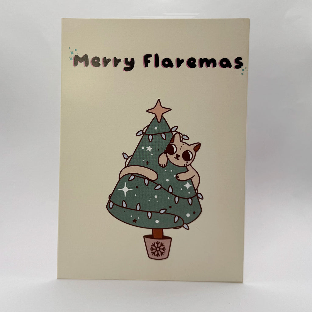 Merry Flaremas A6 Christmas card showing a cute cat tangled in a Christmas tree.