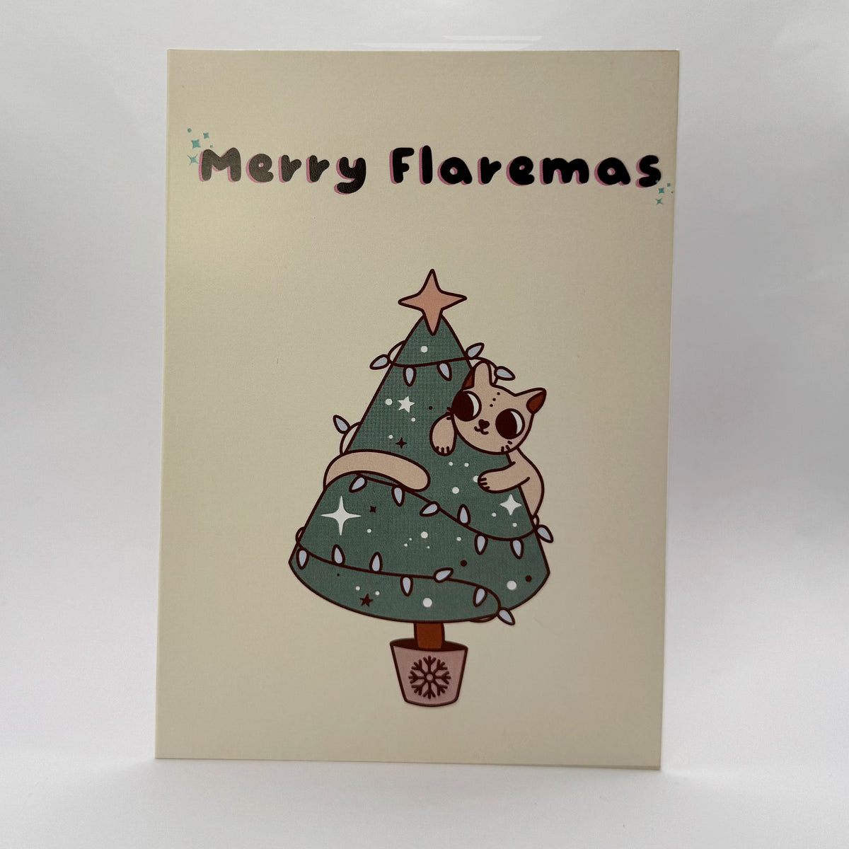 Merry Flaremas A6 Christmas card showing a cute cat tangled in a Christmas tree.