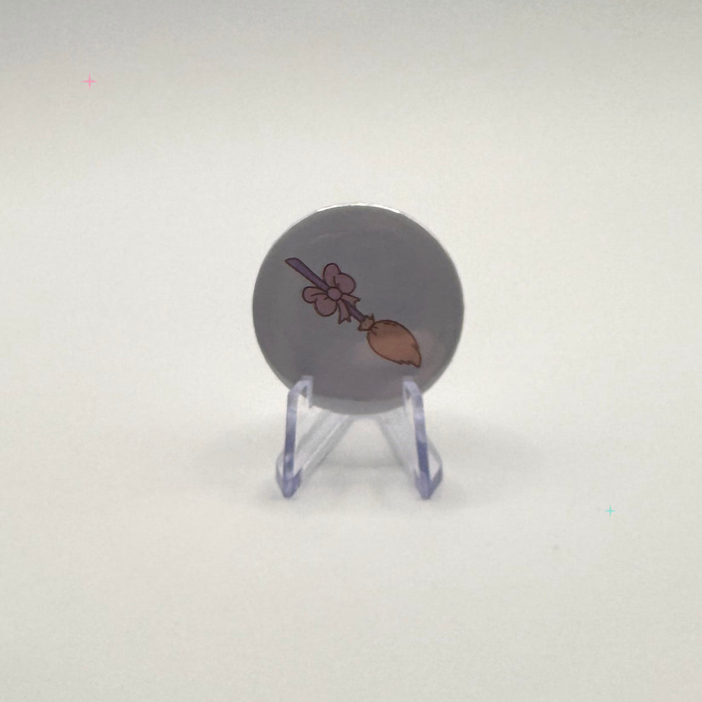 32mm pastel broom badge on a white background