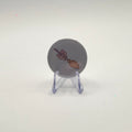 32mm pastel broom badge on a white background