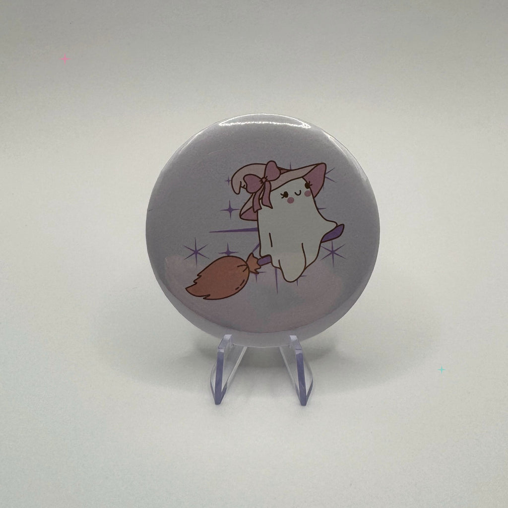 58mm witchy ghost on broom badge on a white background