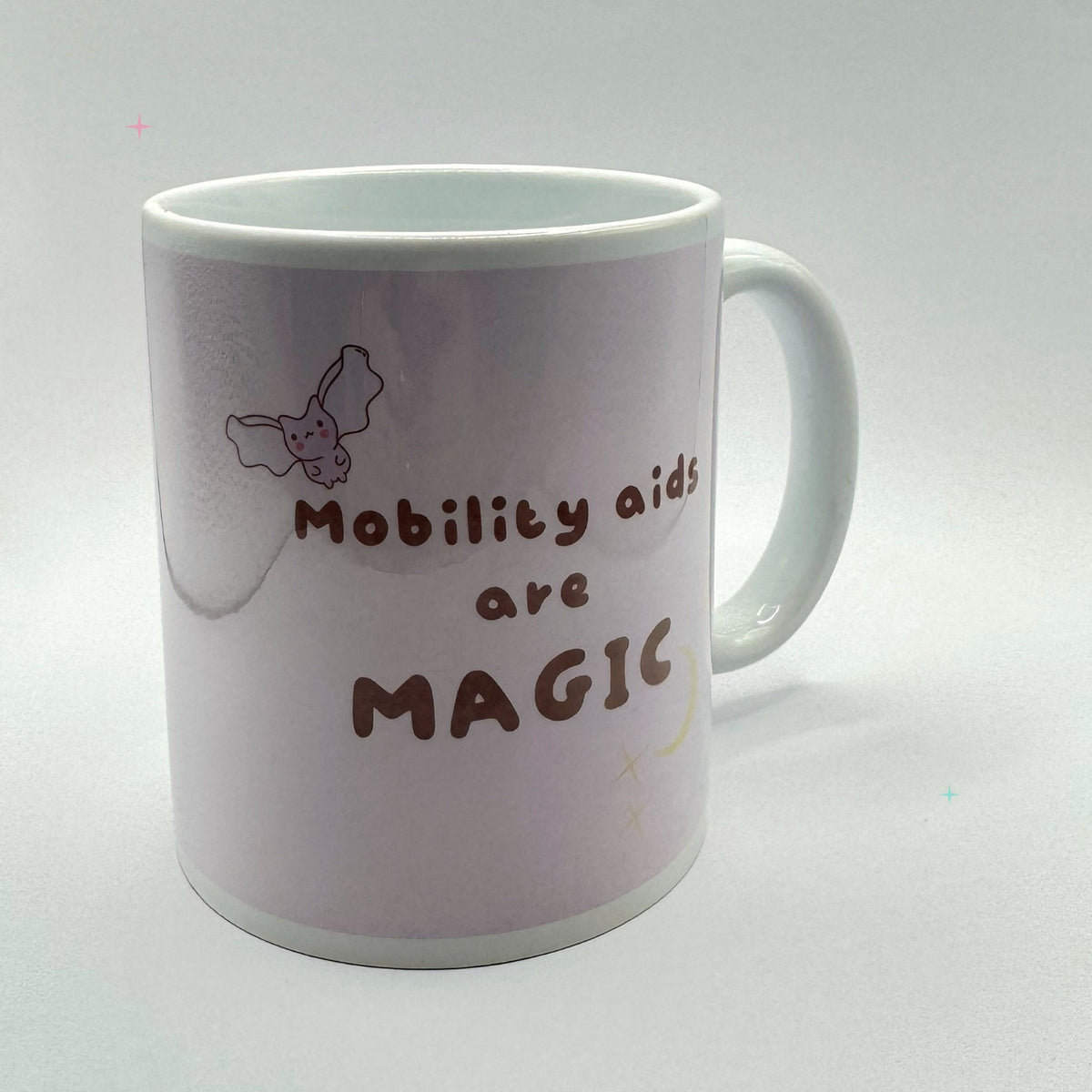 11oz Mobility Aids are Magic mug showing the slogan artwork