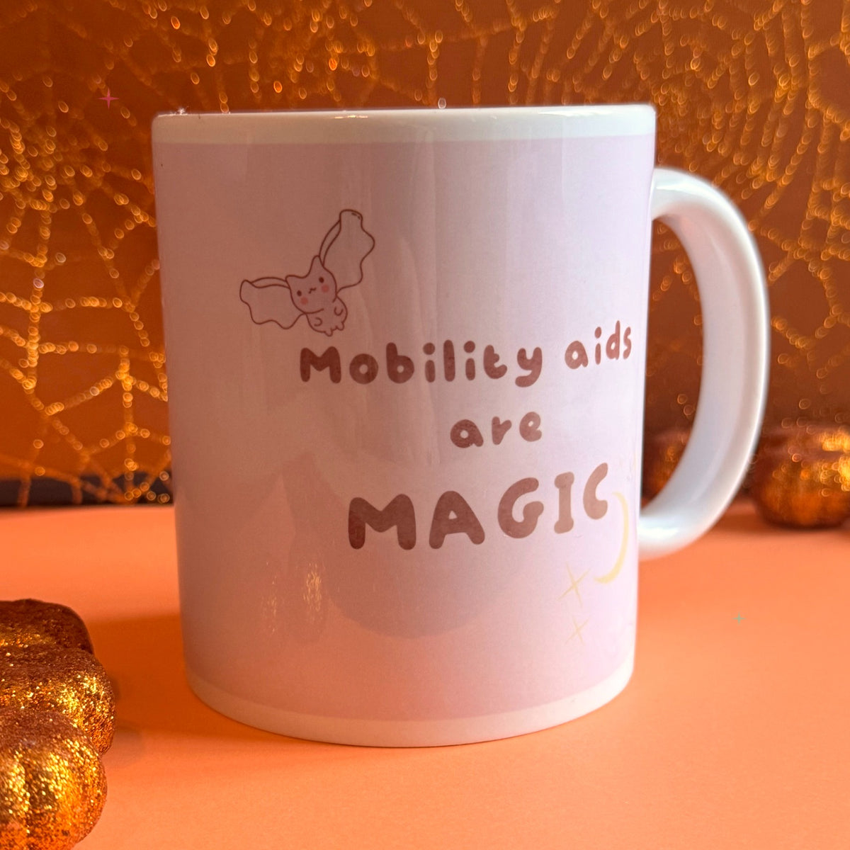 Mobility Aids are Magic slogan mug styled with autumn decor