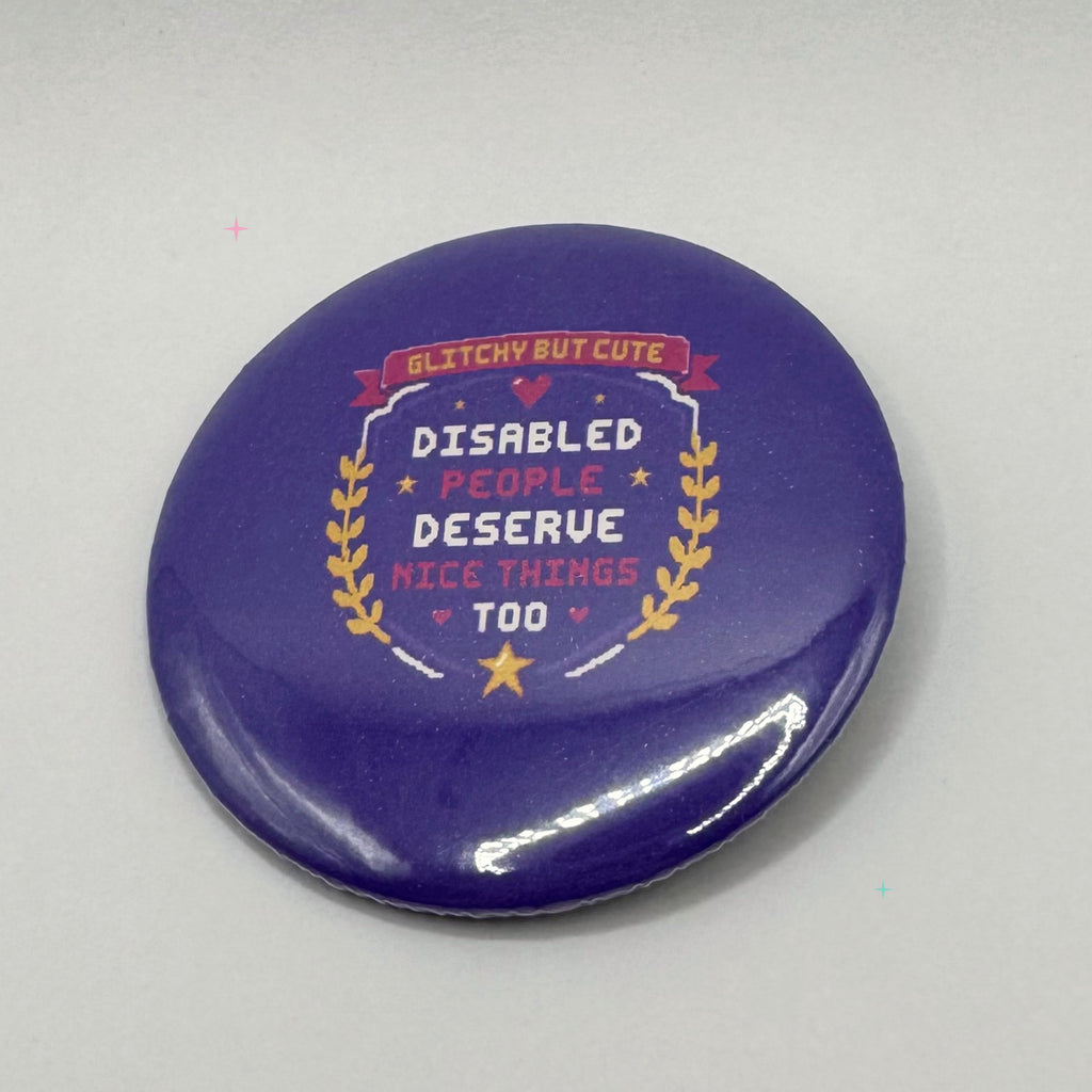 Purple 58 mm pin badge reading Disabled People Deserve Nice Things Too