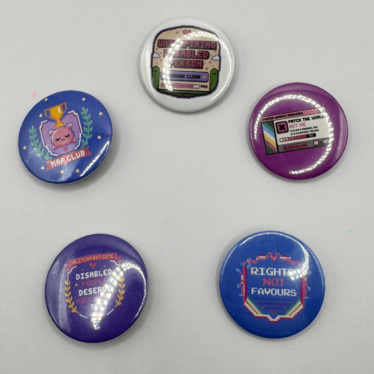 Five assorted 32mm disability pride and chronic illness button badges