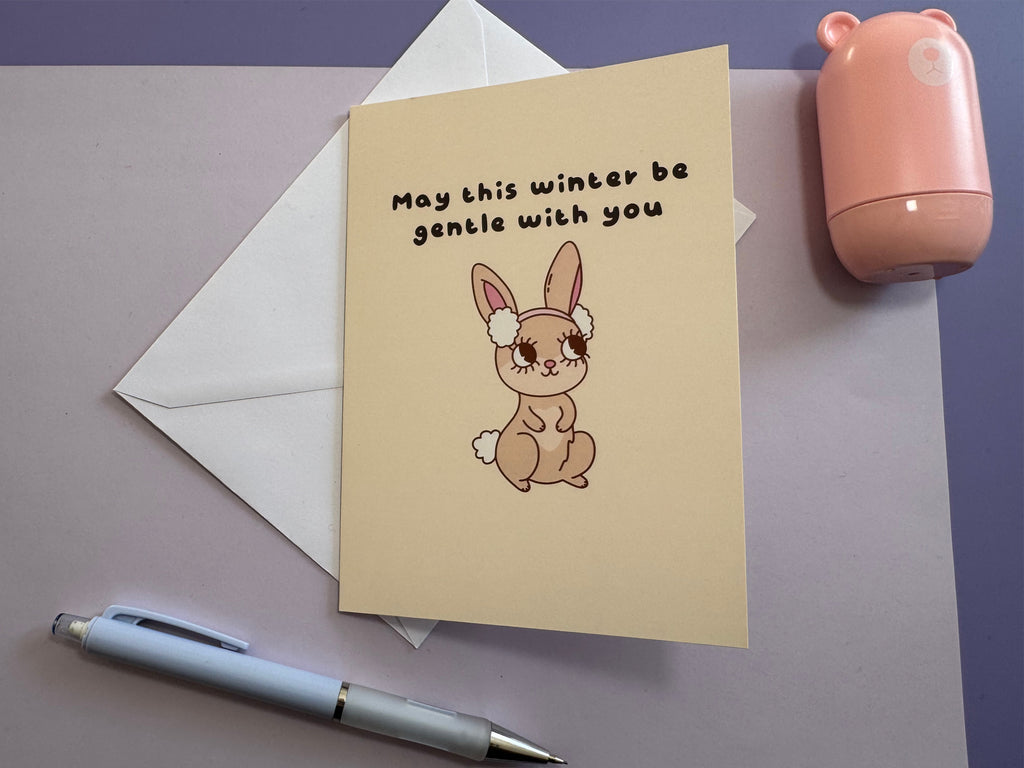 May This Winter Be Gentle With You greetings card photographed in a styled festive flat lay.