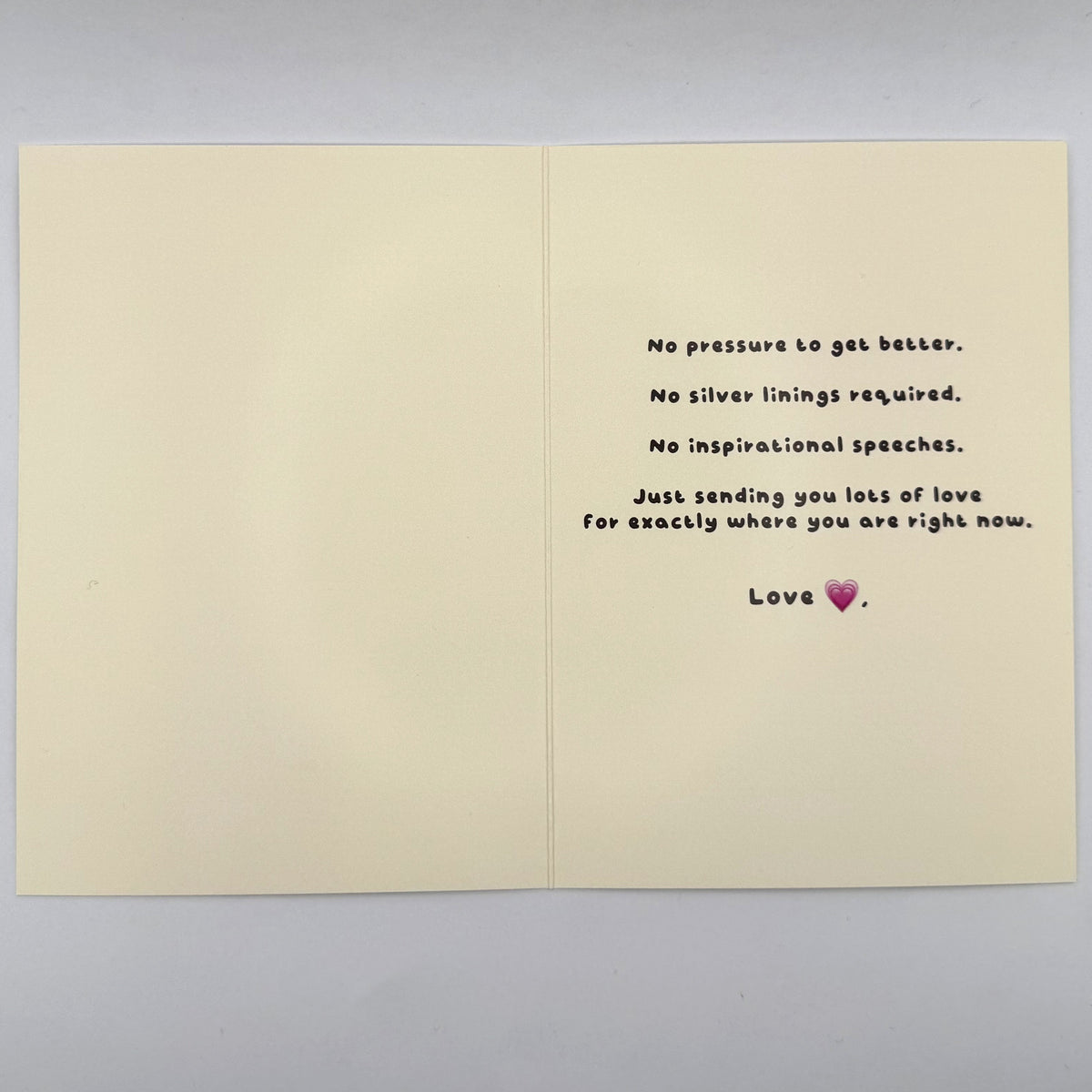 Open Not a Get Well Soon Card showing its printed supportive message inside.
