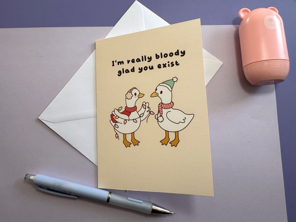 I'm Really Bloody Glad You Exist greeting card in a styled lifestyle photograph.