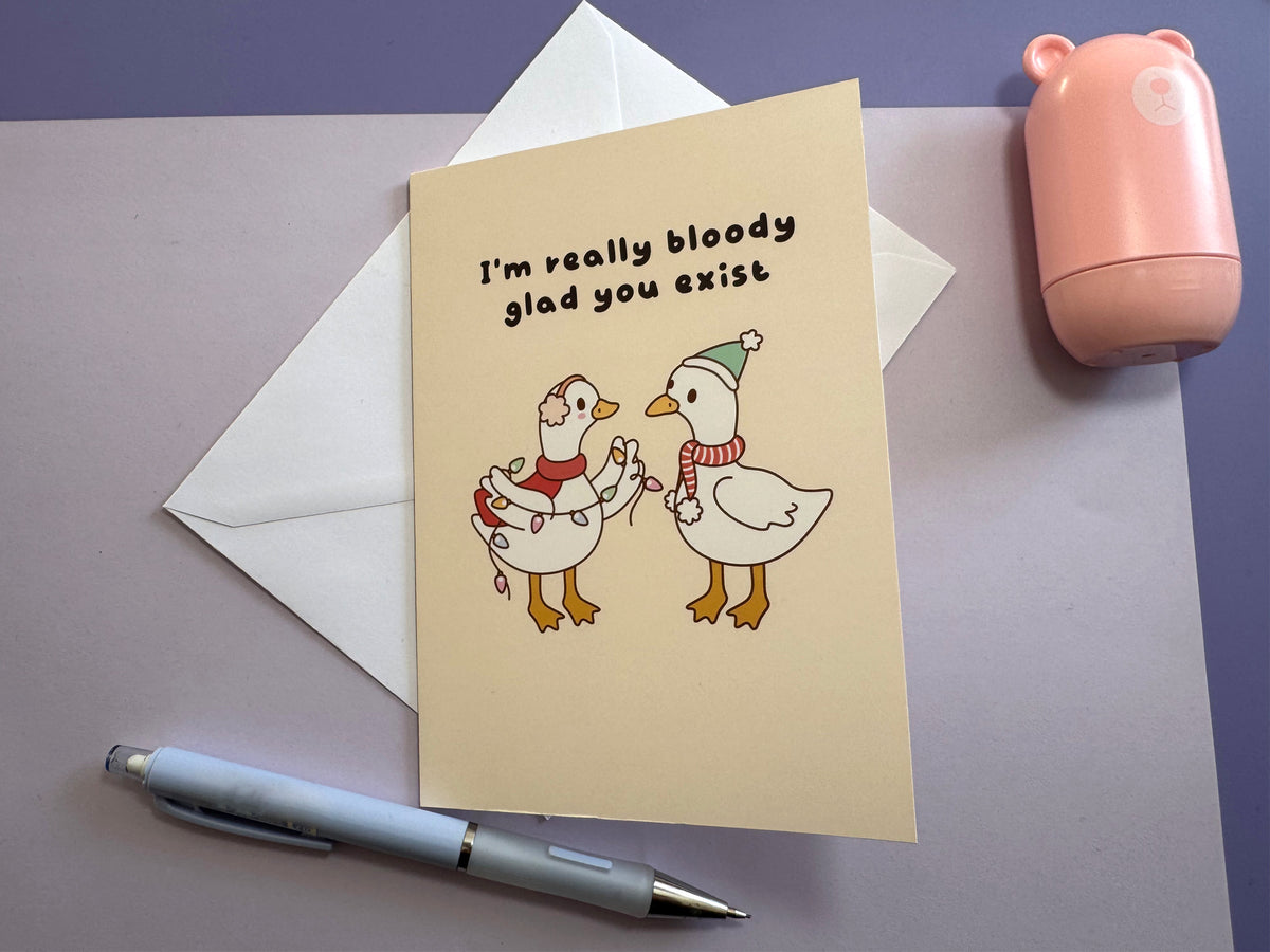 I'm Really Bloody Glad You Exist greeting card in a styled lifestyle photograph.
