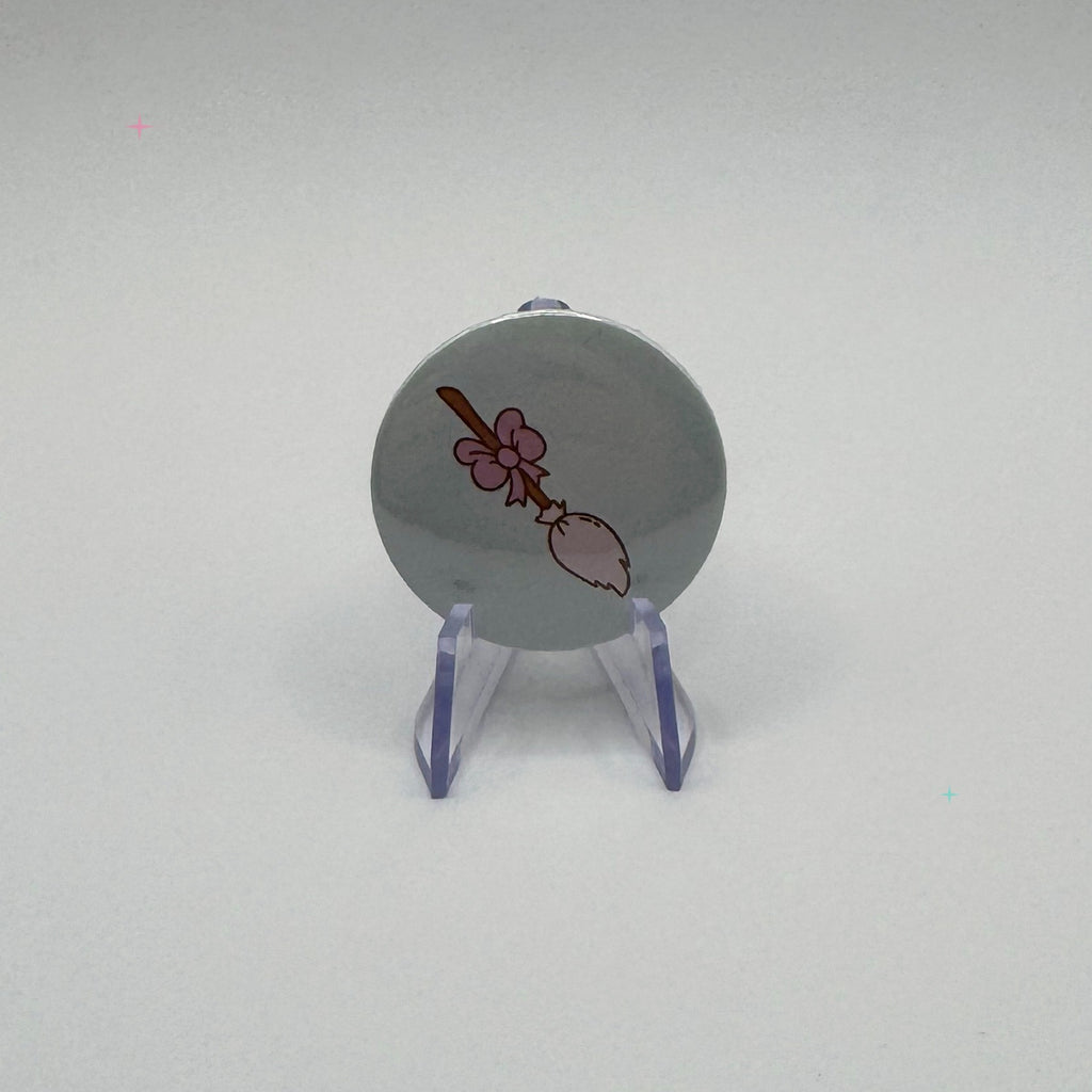 Hexecutive Dysfunction broom with bow 32mm badge on white background