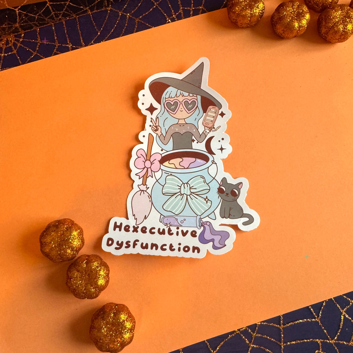 Hexecutive Dysfunction 4 inch die-cut sticker on orange background