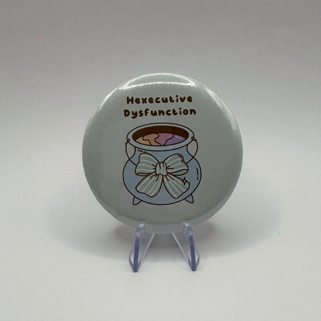Hexecutive Dysfunction cauldron slogan 58mm badge on white background