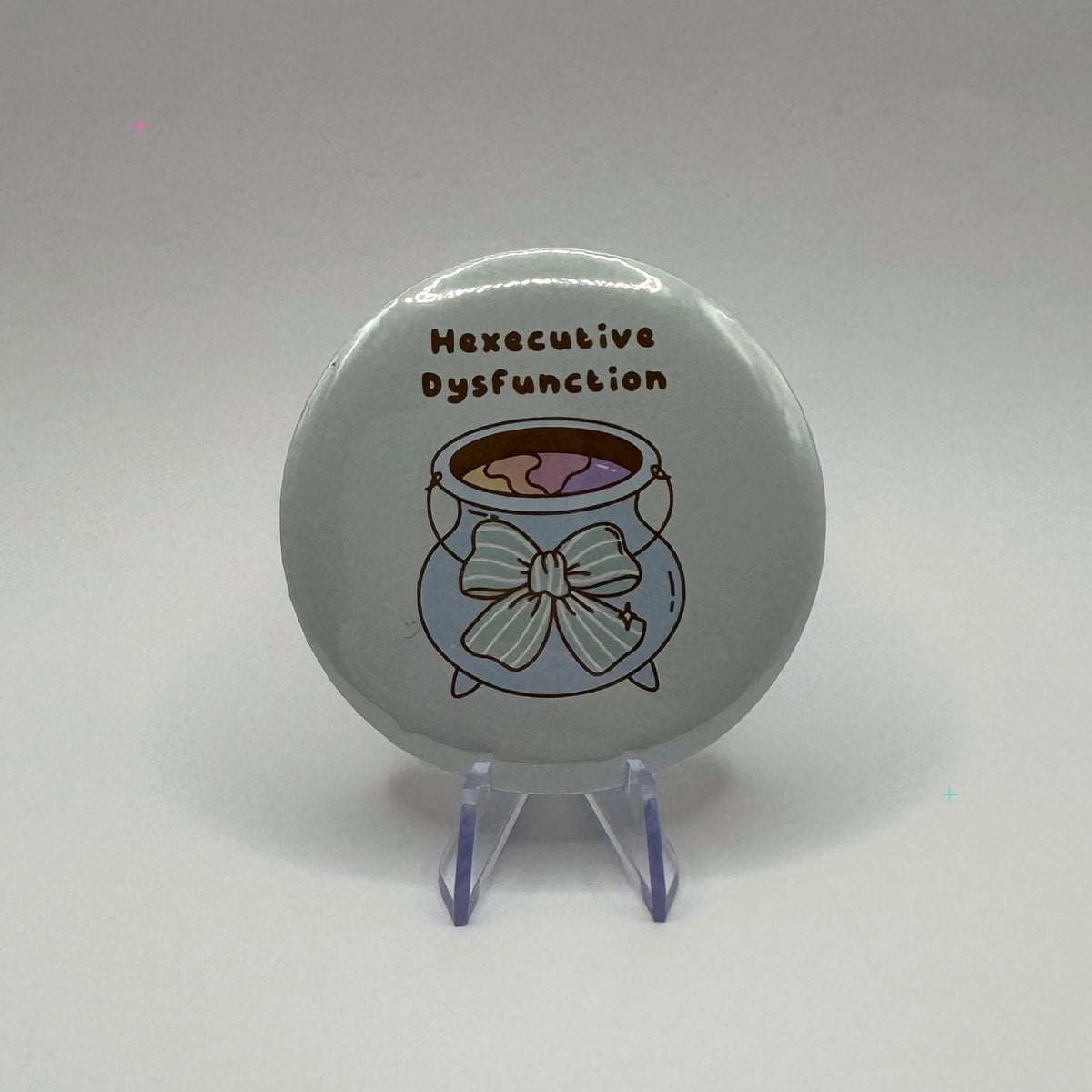 Hexecutive Dysfunction cauldron slogan 58mm badge on white background