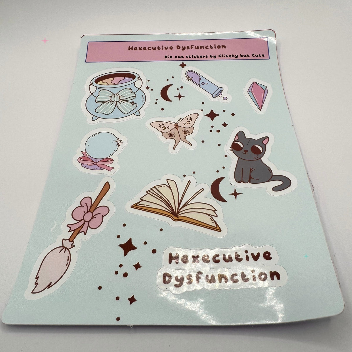 Hexecutive Dysfunction glossy sticker sheet on white background