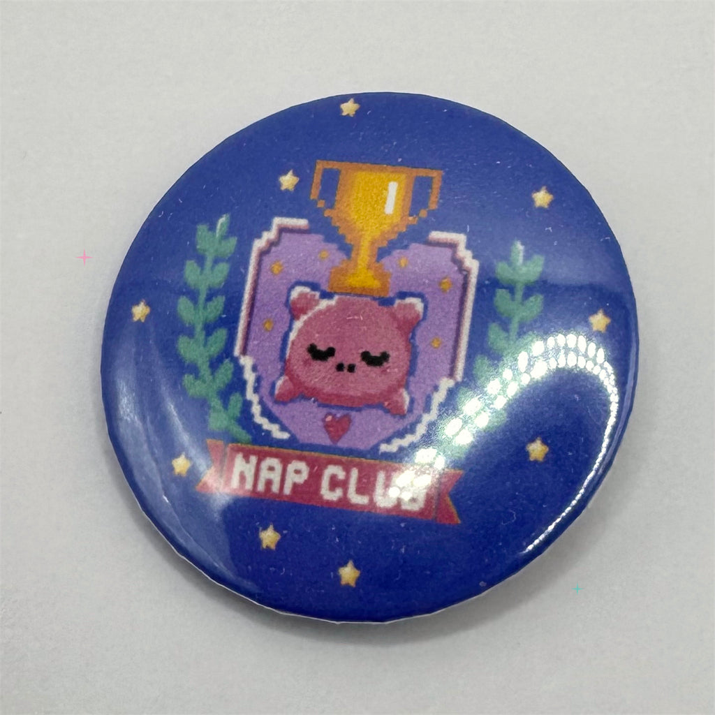 Large 58mm Nap Club button badge with sleeping pillow and trophy design
