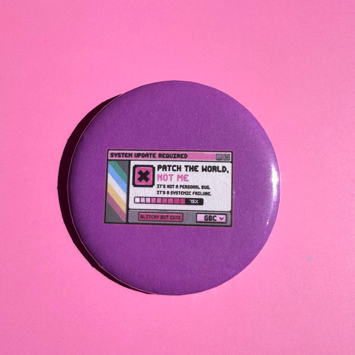 58mm purple Patch the World, Not Me button badge on a pink background