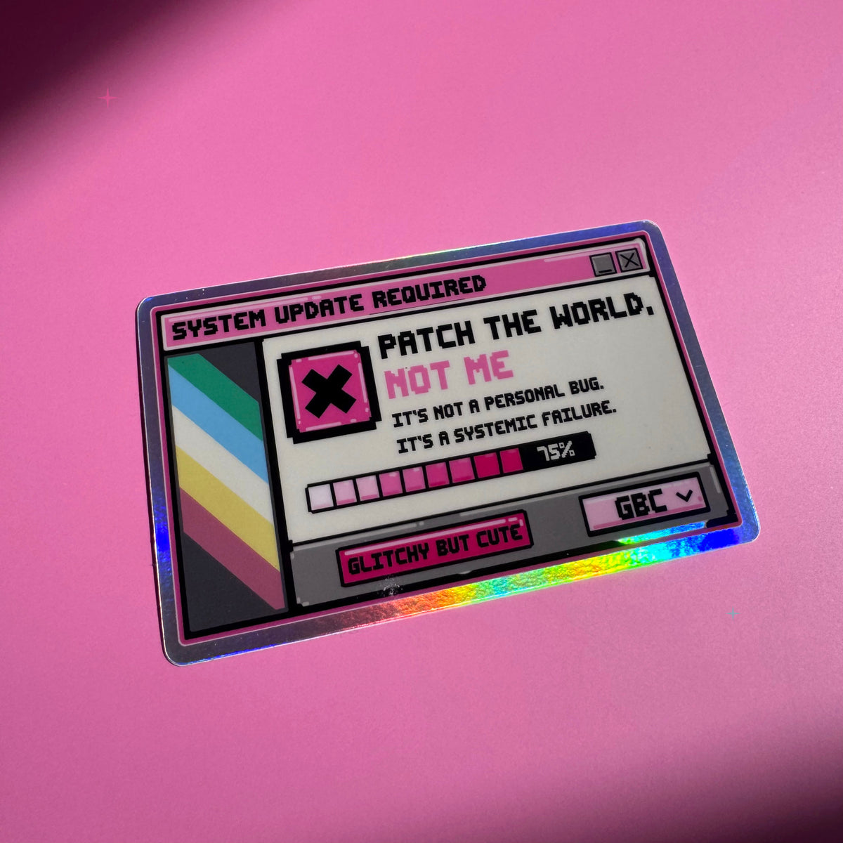 Patch the World, Not Me holographic sticker with a retro system-update design on a pink background
