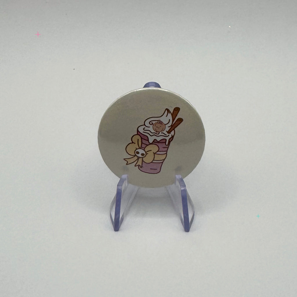 32mm pumpkin spice drink badge on a white background