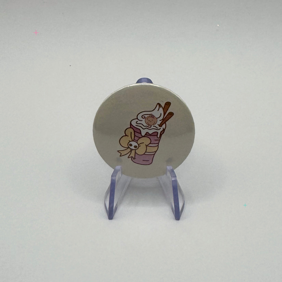32mm pumpkin spice drink badge on a white background