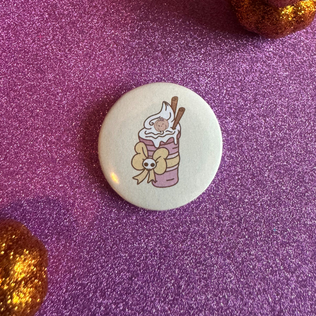 Pumpkin spice drink badge on a glittery pink background