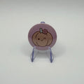 32mm smiling pumpkin badge on a white background