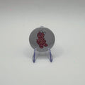 32mm pink voodoo doll badge on a white background