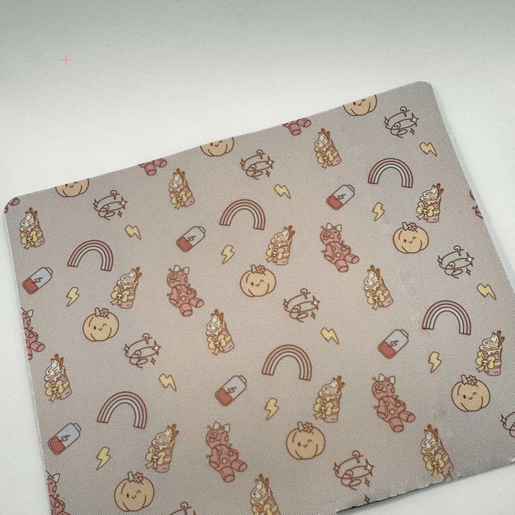 Pumpkin Spice and Symptom Spikes patterned mousemat on a white background