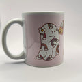 11oz Pumpkin Spice and Symptom Spikes mug showing the ghost artwork